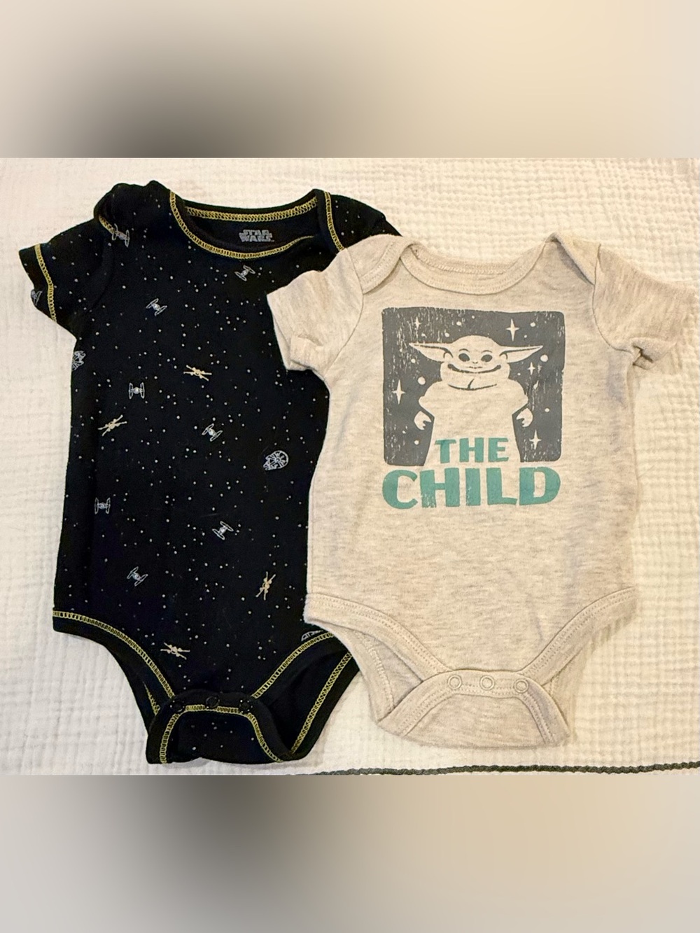 2 Star Wars onesies, “The Child” 3mos. Black space & TIE fighter pattern 6/9mos